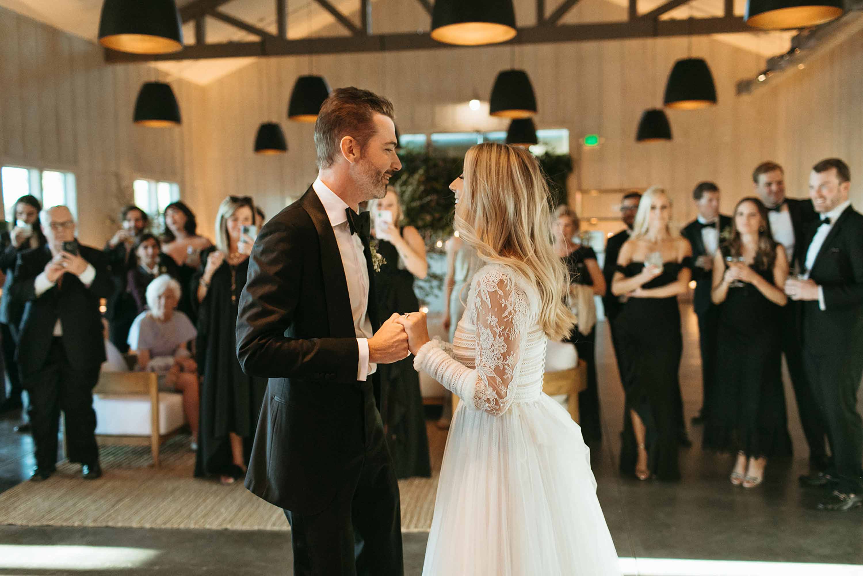 couple having their first dance during their wedding at the barn